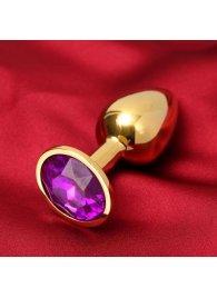 Золотистая анальная пробка с фиолетовым кристаллом - Сима-Ленд - купить с доставкой в Нижнем Новгороде