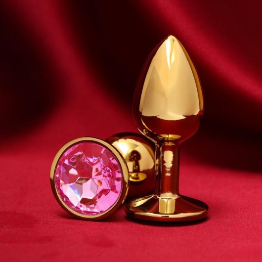 Золотистая анальная пробка с розовым кристаллом - Сима-Ленд - купить с доставкой в Нижнем Новгороде